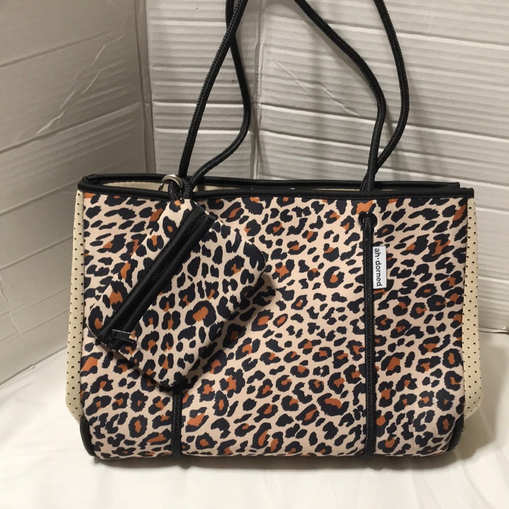 Ah-dorned non leather tote with pouch. NWOT